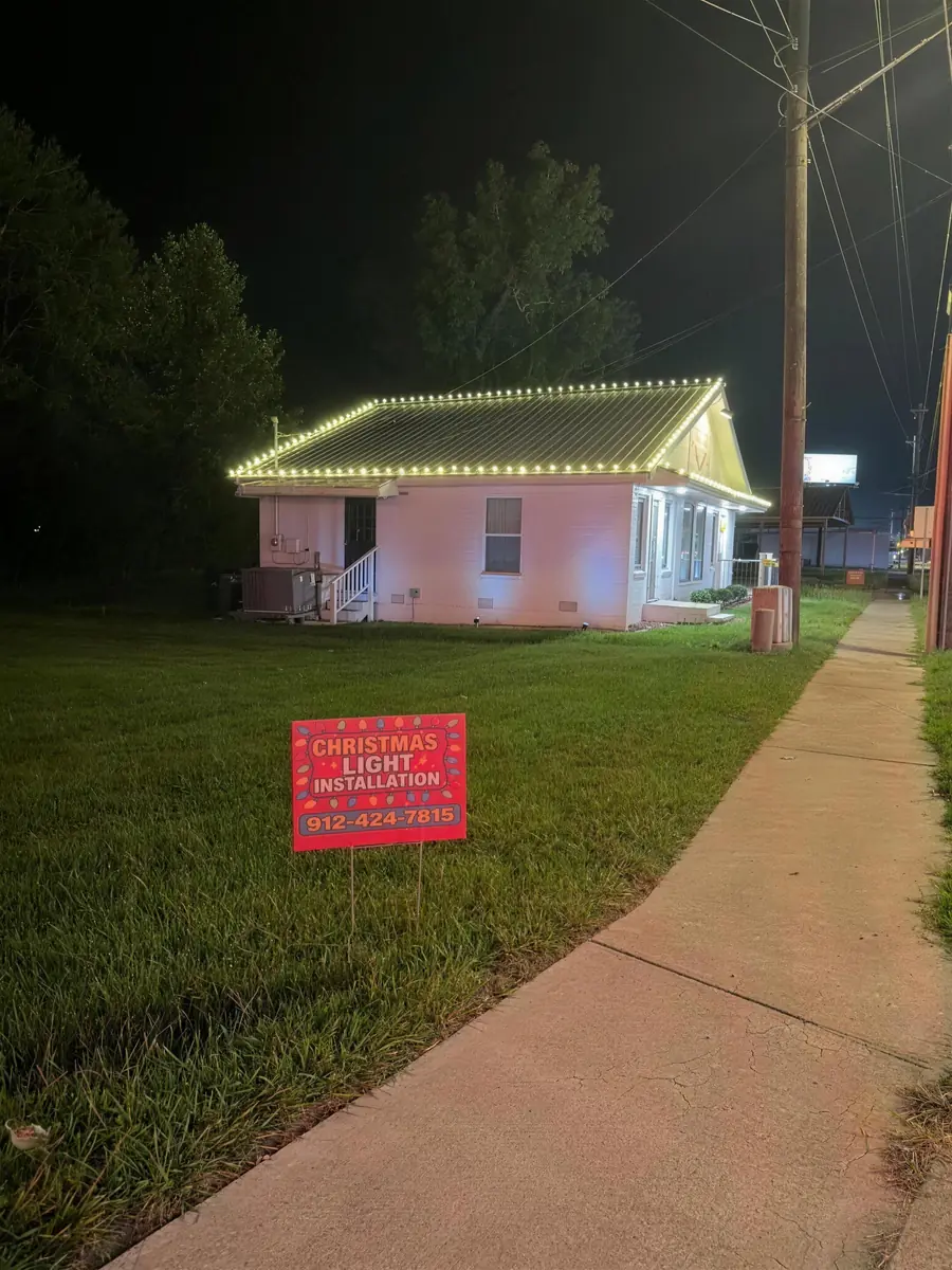 A ranch roofline finished, with the Southern Lighting sign out front