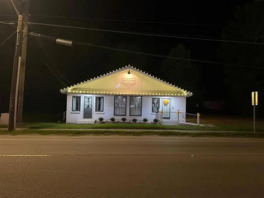 A Liberty County storefront lit up after dark